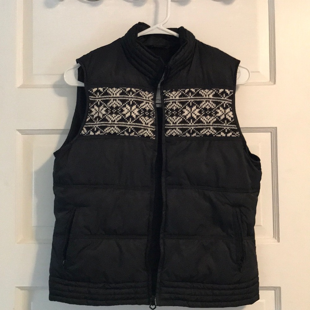 Black puffer vest with snowflake and heart detail